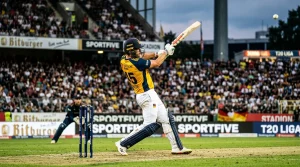 Batsman bei einem kraftvollen Schlag im Cricket